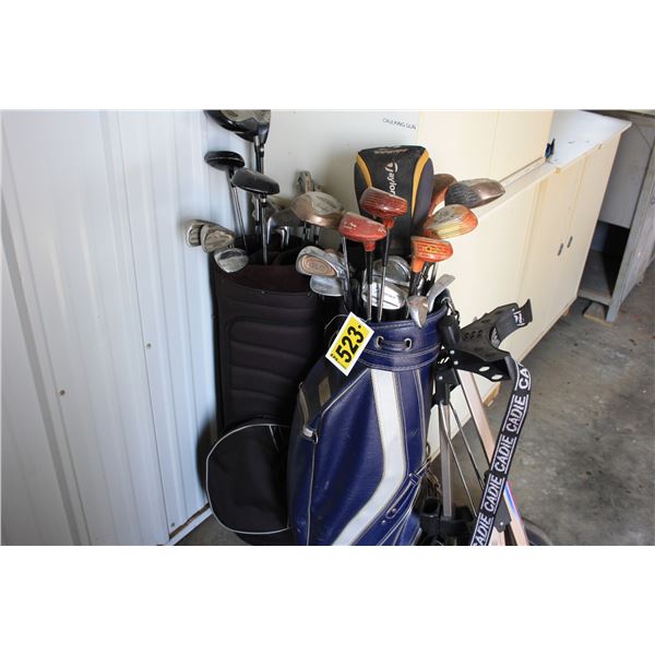 2 sets of golf clubs with pull cart
