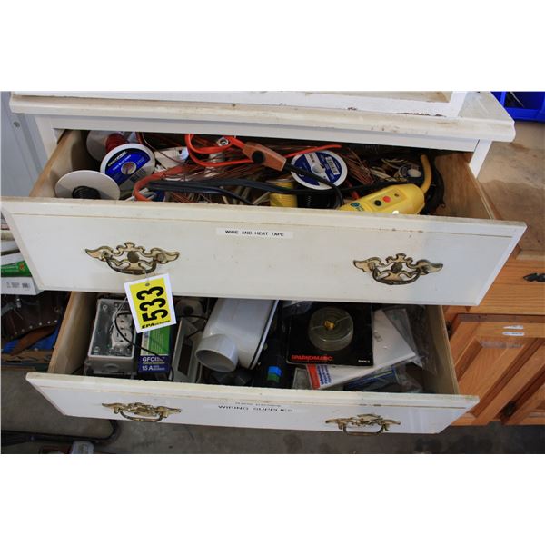 white dresser with electrical contents