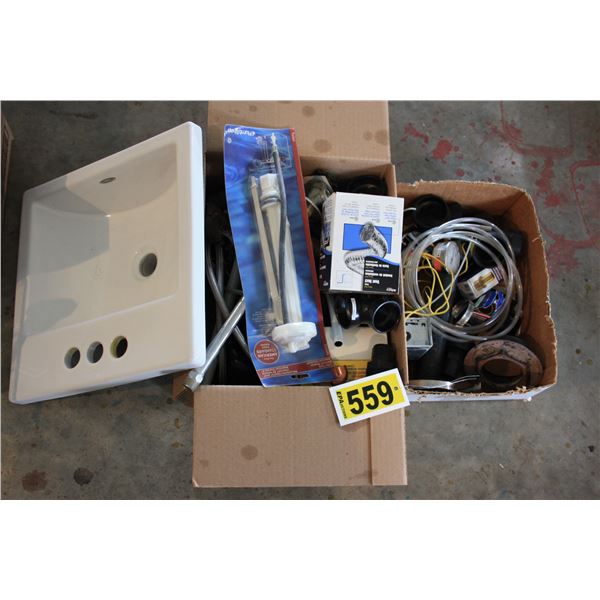assorted plumbing supplies and bathroom sink