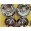 Image 1 : 1957 Ford Sunburst Bullet Hubcaps