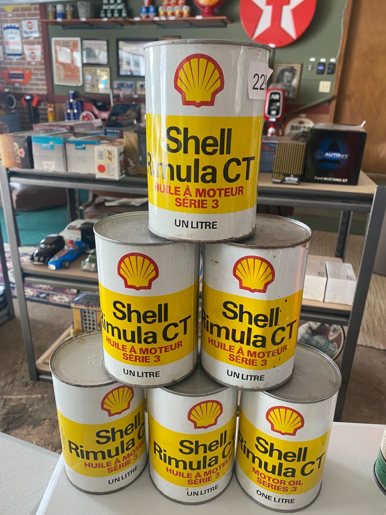 Shell Gas Container Six One Litre Cans of Shell Motor Oil - Beck Auctions Inc.