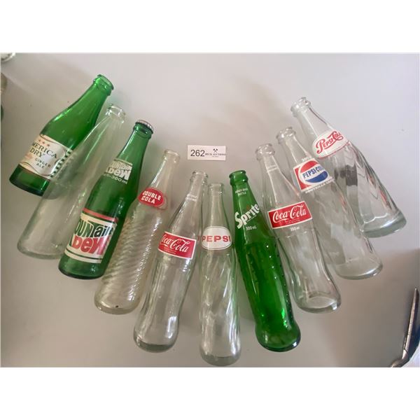 10 assorted Soda bottles  Pepsi-cola, coca-cola, sprite, mountain dew, double-cola, American Dry