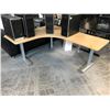 Image 1 : STEELCASE MAPLE/GREY 70" X 58" ELECTRIC SIT/STAND CORNER PROGRAMMERS TABLE - LEFT HAND HAS CHIP ON