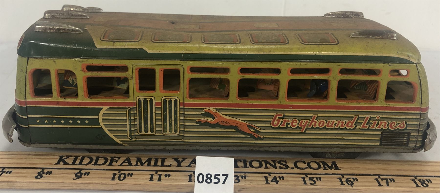RED RIBBON GREYHOUND LINES TIN FRICTION BUS - Kidd Family Auctions