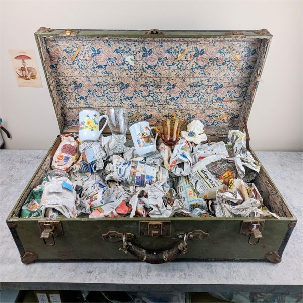 Antique suitcase with mystery glass selection