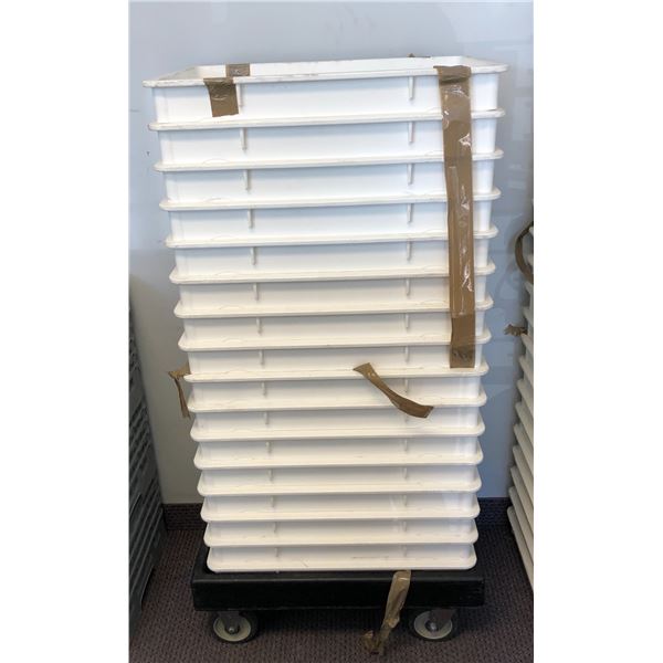 Set of 16 white stackable food grade trays w/ 4-wheel dolly (approx 25 1/2" W x 18 L x 3 1/2" D)