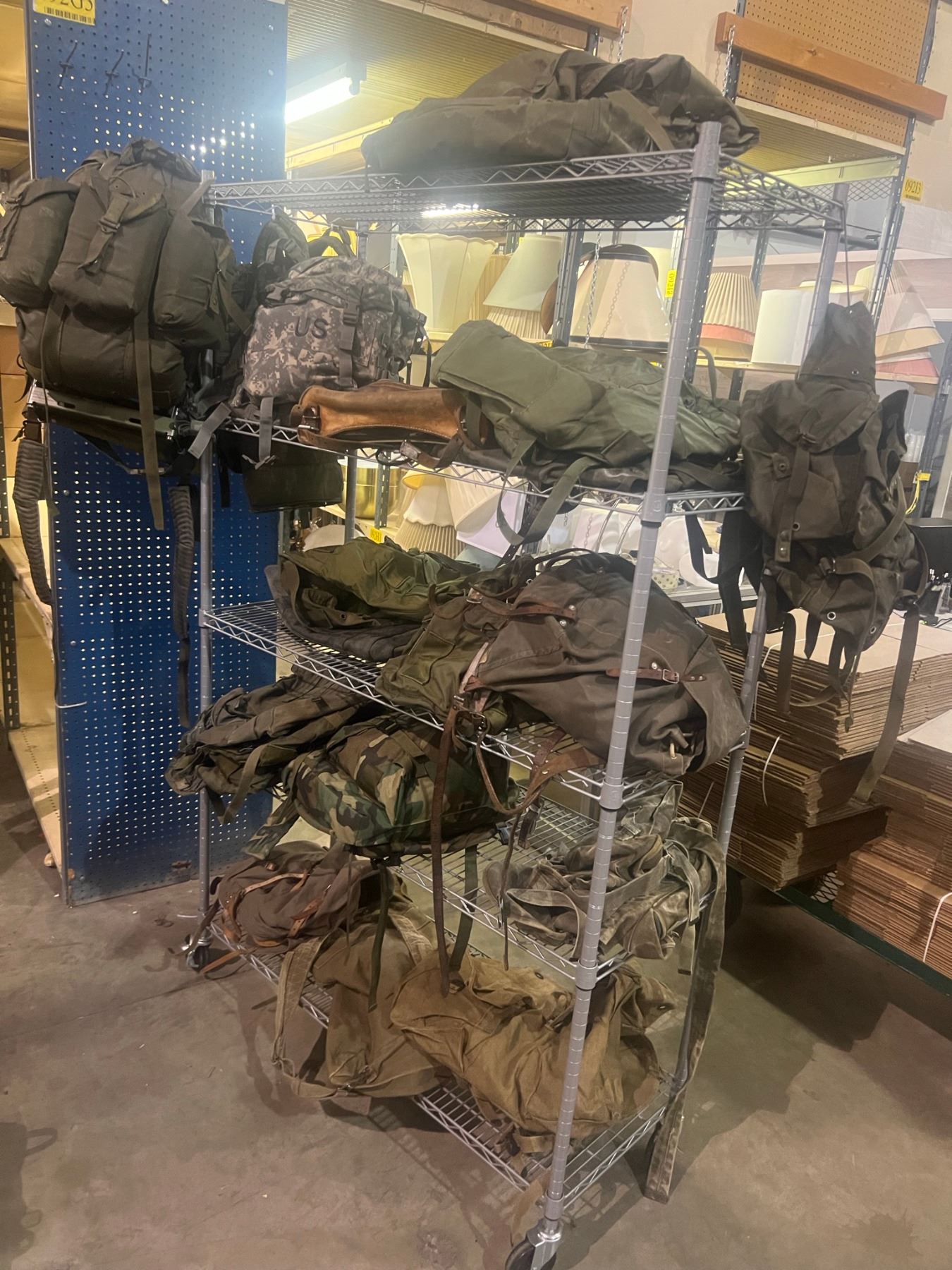 Rack full of US, Canadian Military knapsacks & misc. bags (RACK NOT ...