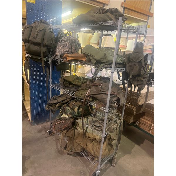 Rack full of US, Canadian Military knapsacks & misc. bags (RACK NOT INCLUDED)