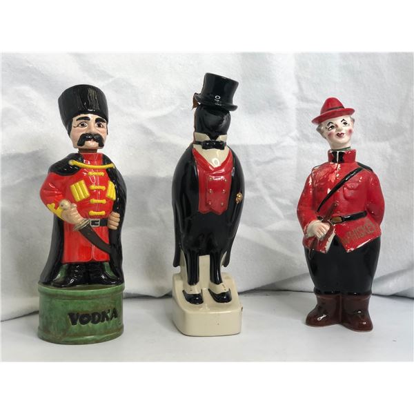 Group of 3 whiskey / vodka decanters - includes Canadian Mounty whiskey drinker man liquor decanter