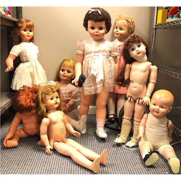 Group of 8 large assorted vintage creepy dolls - includes girl w/ gun in hand / baby dolls / talking