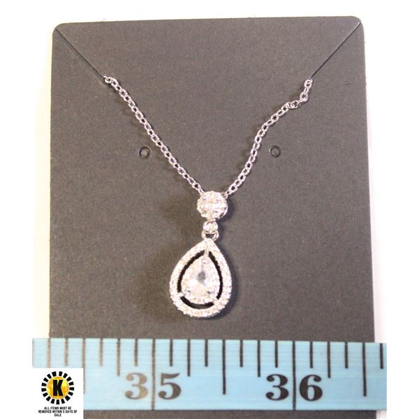 PEAR SHAPED CENTER WITH CLEAR STONE