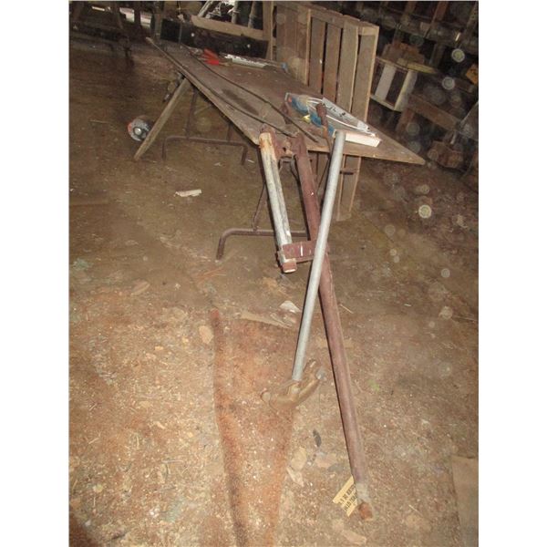 Wooden Table, Booster Cable Ends, Flame Thrower, Homemade Pipe Holder, Wood Pallet, Water Pump, Misc