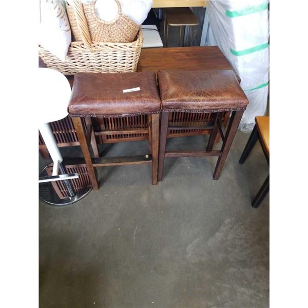 PAIR OF LEATHER SADDLE STOOLS