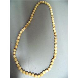 Set of fossilized, ivory beads,  24" 66 graduated beads, (2)