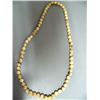 Image 1 : Set of fossilized, ivory beads,  24" 66 graduated beads, (2)