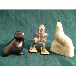 Jade Bird by Punesuk, 1989 Soapstone man, snow shoes and seal (37)