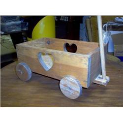 Childs wooden toy cart heart pattern