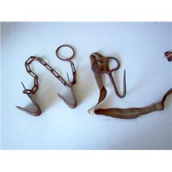 ANTIQUE COW KICKERS AND ICE HOOK W/ LANYARD