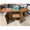 Image 1 : White sewing machine in cabinet with stool