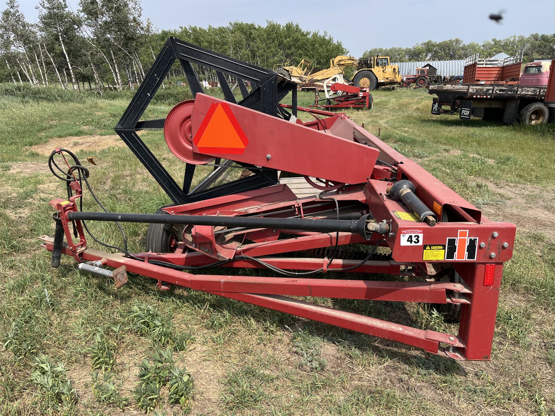 International 75 Pull type Swather. Bat Reel, 24ft. New Canvases