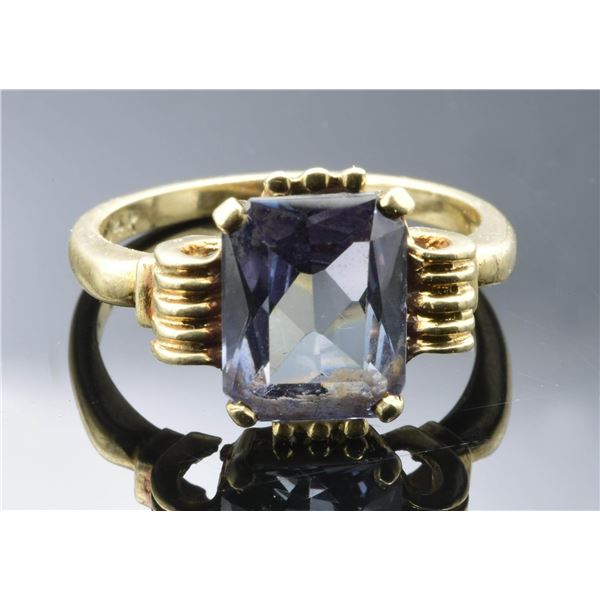 14KT GOLD BLUE TOPAZ RING.
