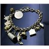 Image 1 : LADY'S 10KT GOLD SMALL CHARM BRACELET AND CHARMS.