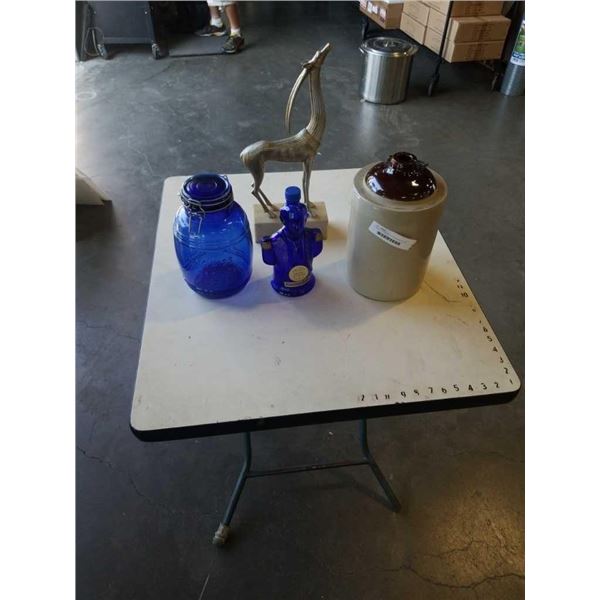 FIGURE LIQUOR BOTTLE WITH BLUE GLASS CANNISTER, ANIMAL STATUE AND CROCK