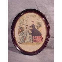 Framed print in oval wood frame