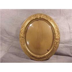 Gold painted oval frame w/convex glass