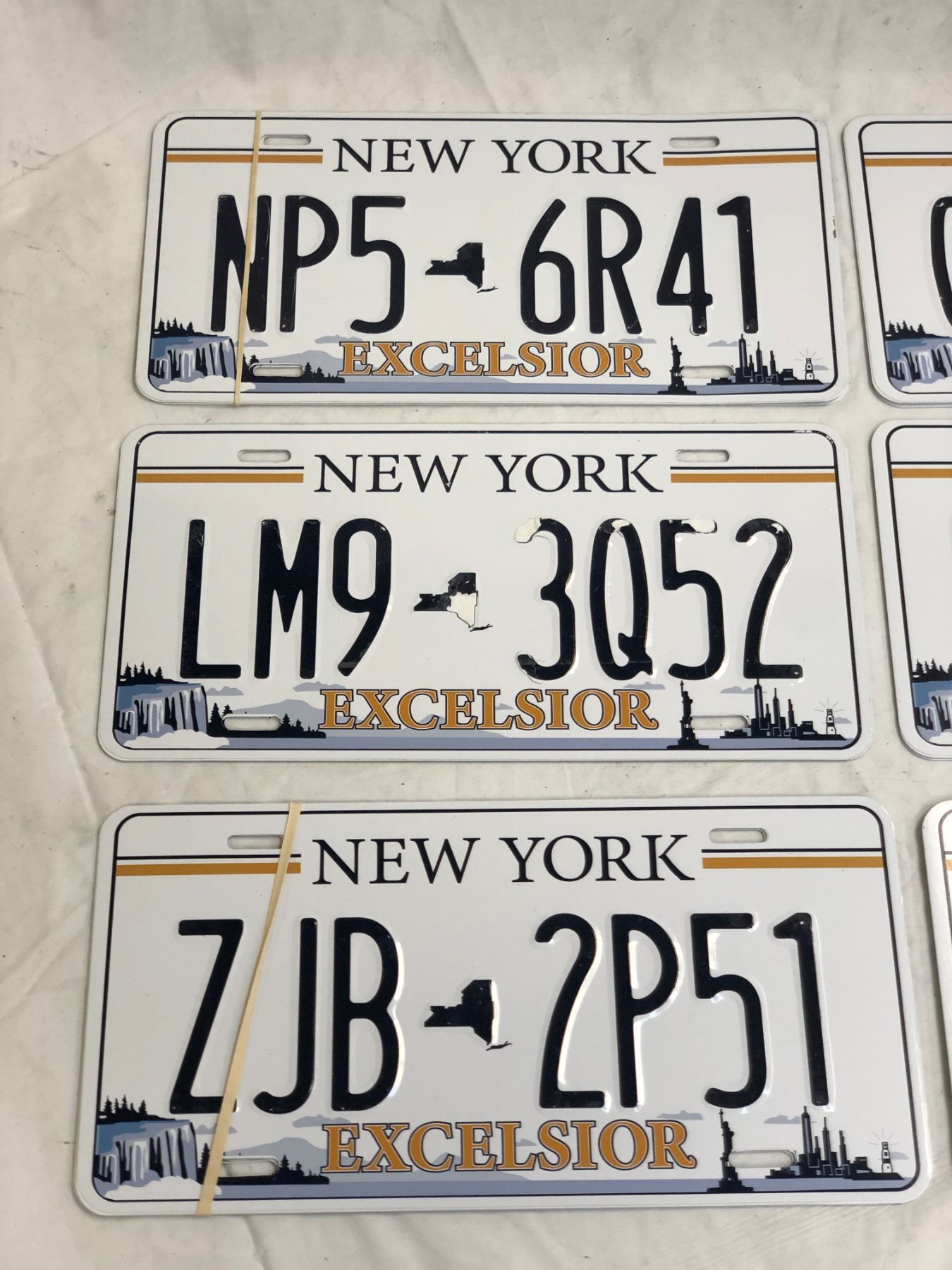 Excelsior Numbers Group of assorted New York Excelsior prop number plates