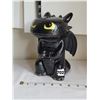 Image 1 : Toothless' Dragon bank  from the movie ”How to train your Dragon”