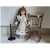 Image 1 : Beautiful porcelain doll on removable stand, with wooden rocking chair.