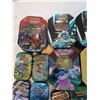 Image 3 : 7 Pokemon tins with games 7 empty tins 5 packs sleeves