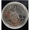 Image 2 : 1975 Calgary Centennial Silver Dollar. Popular cowboy on bucking bronco. Bright White. Housed in its