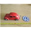 Image 1 : Volkwagen Beetle model car and VW badge