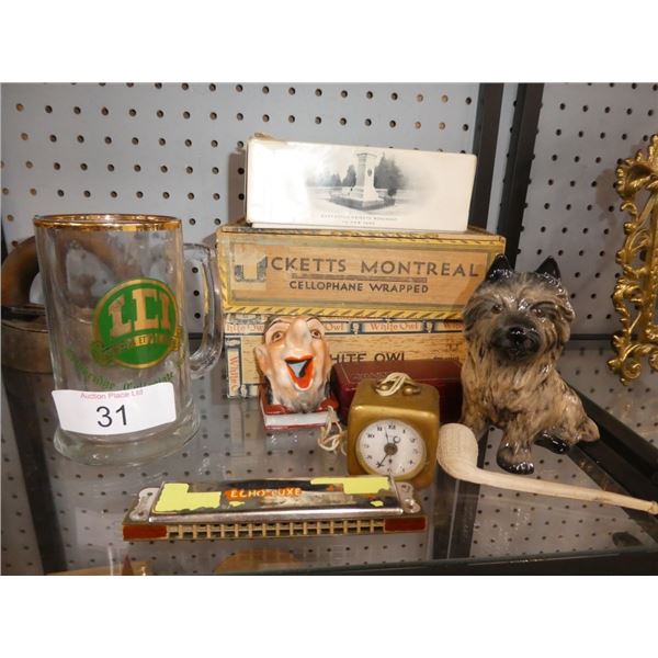 harmonica, pipe, decorative dog, alarm clock, mug