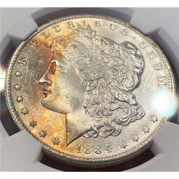 Toned 1884-O Morgan Silver Dollar NGC MS65