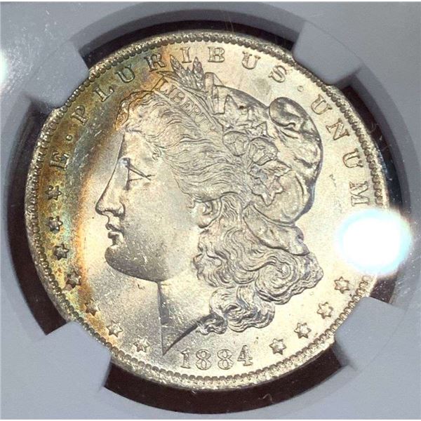 Toned 1884-O Morgan Silver Dollar NGC MS65