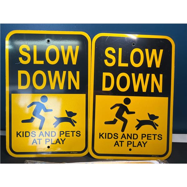 Lot of 4 "Slow Down - Kids & Pets at Play" Metal Signs