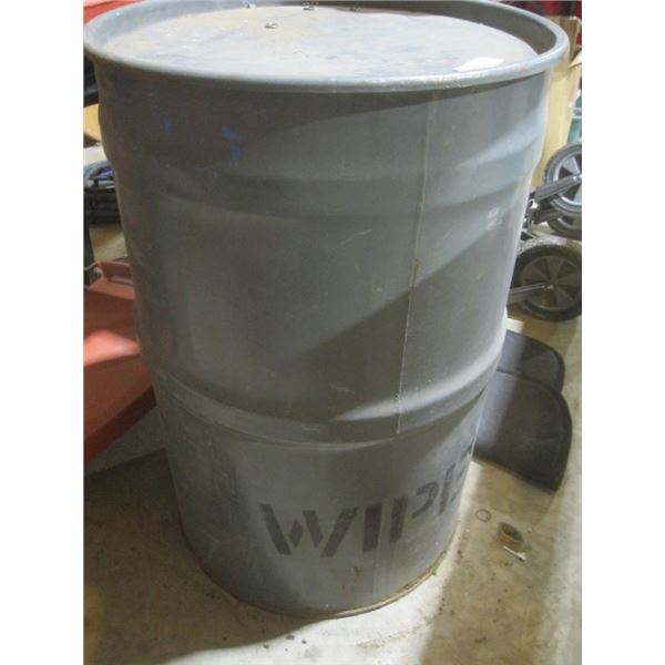 metal barrel with wipeing rags in it