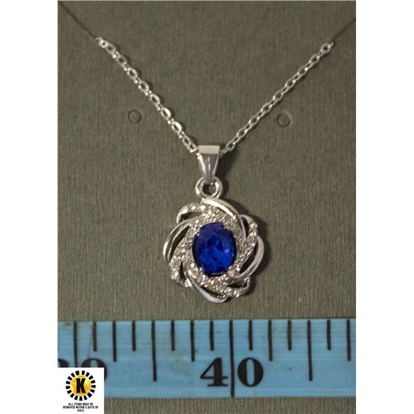 #122ÿ6 X 8 BLUE OVAL STONE WITH CLEAR ACCENTS ON
