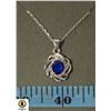 Image 1 : #122ÿ6 X 8 BLUE OVAL STONE WITH CLEAR ACCENTS ON