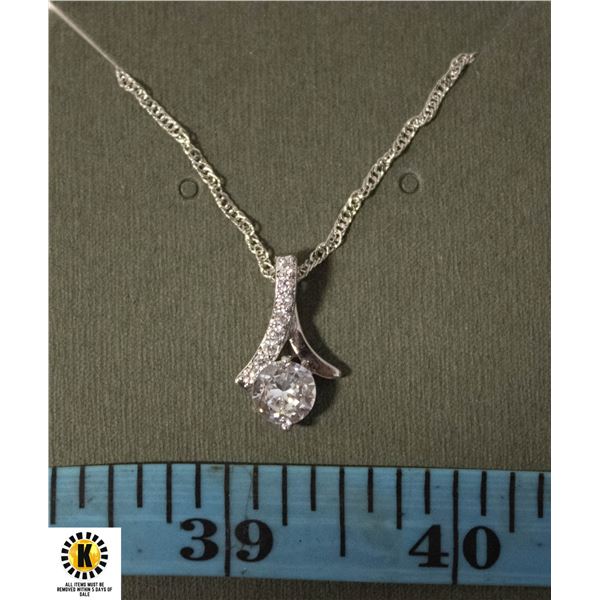 #123 1.5 CT CLEAR STONE WITH CLEAR ACCENTS ON 45 C