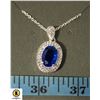Image 1 : #121 10 X 14 MM OVAL BLUE STONE SURROUNDED BY 2