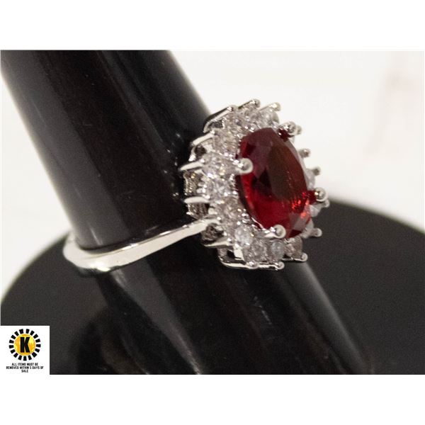 #109 8 X 10 MM RED OVAL STONE SURROUNDED IN HALO B