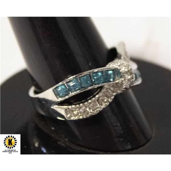 #117 PRINCESS CUT LIGHT BLUE STONES WITH CLEAR
