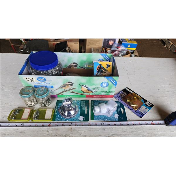 Misc items - Shower arm mount/wall mount, screws, clips, bicycle phone holder, and container filled 