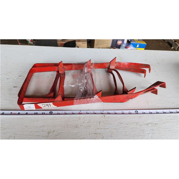 Pair of red metal snow grips