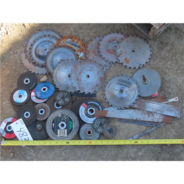 Lot of assorted saw blades and grinder blades