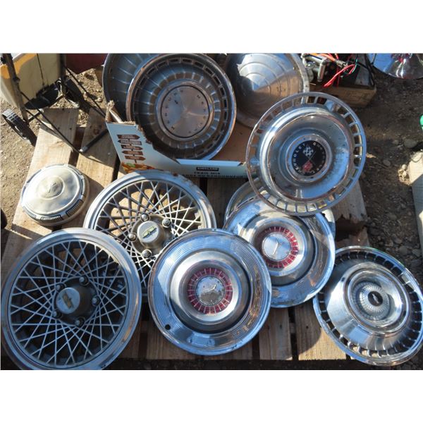 Large box of assorted vintage hubcaps